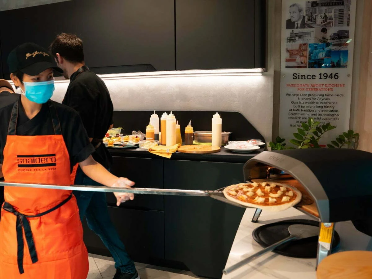 A Pasta Fresca live pizza station serving guests at an event